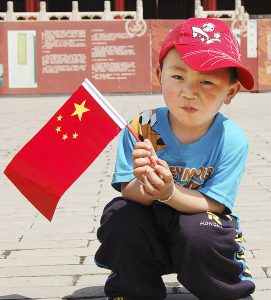 Chinese boy with flag