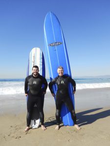 alex-and-steve-with-surfboards-vertical